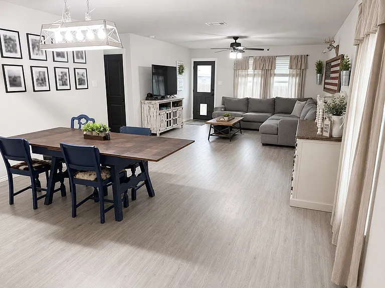Furnished dining room and living room