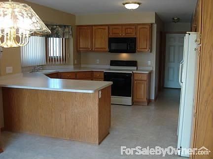 Kitchen with Dining Area
						:
						Island has a 12 inch overhang. A door wall (not shown) leads to a wooden deck.
