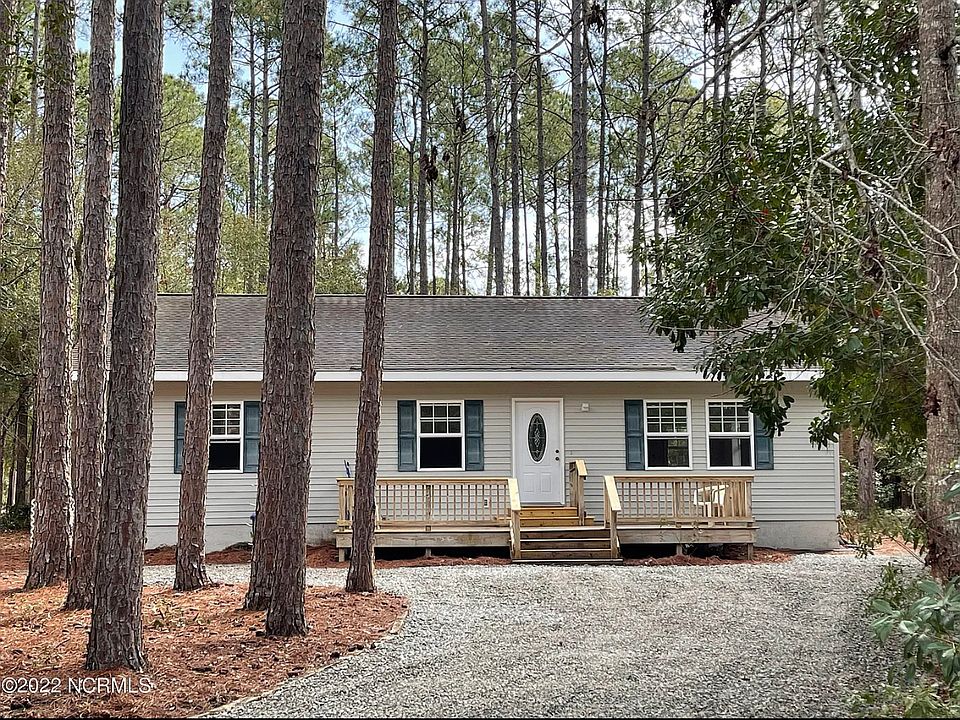 View of the front of the house from down the driveway.