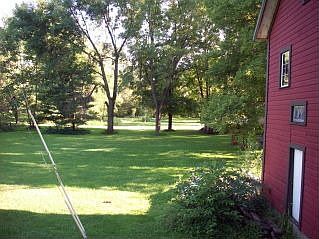 View of backyard and garage
