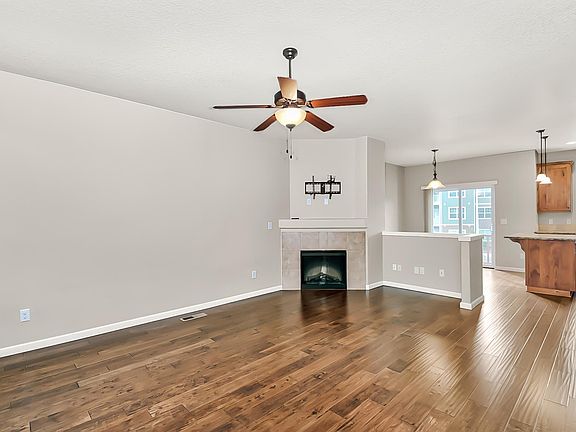 Family room with electric fireplace with fan. Great for making main level cozy during rainy days.