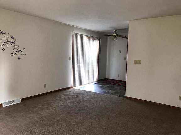 living room (from front door looking into dining area and pa