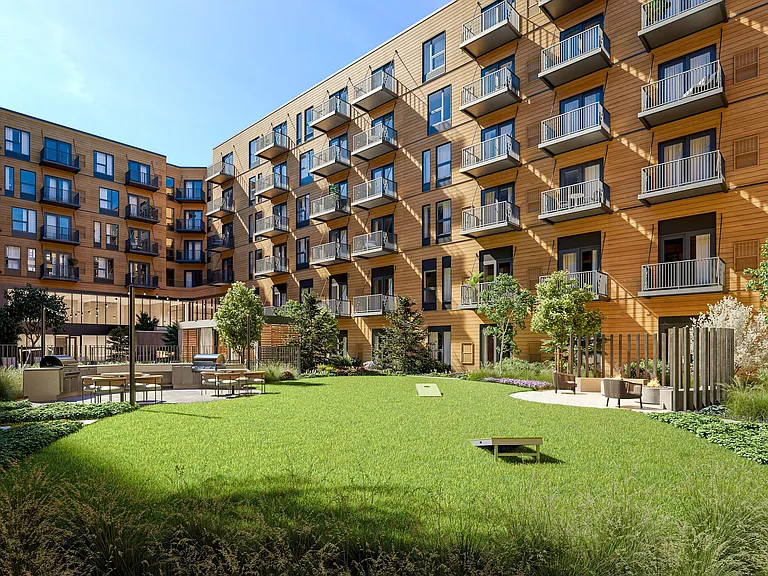 Stunning modern apartment complex with elegant balconies, lush green courtyard, and inviting outdoor seating area, perfect for relaxation and entertainment.