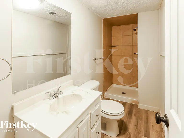 5905 NW Whispering Oaks Ln — Photo 17