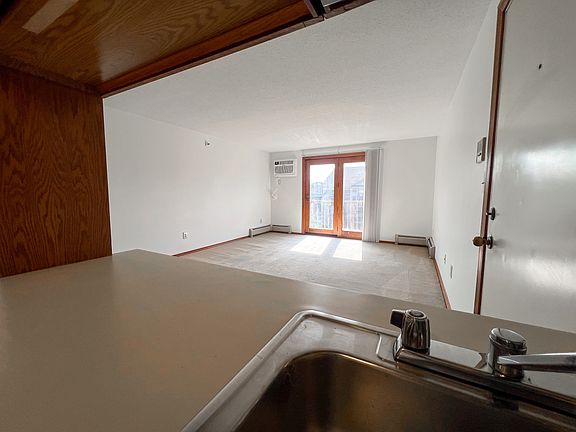 Living room and doors out to private patio