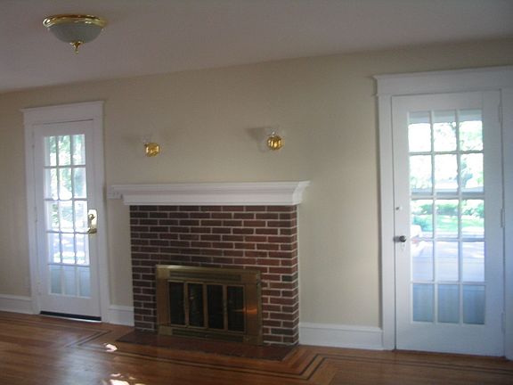 Living room with brick fireplace