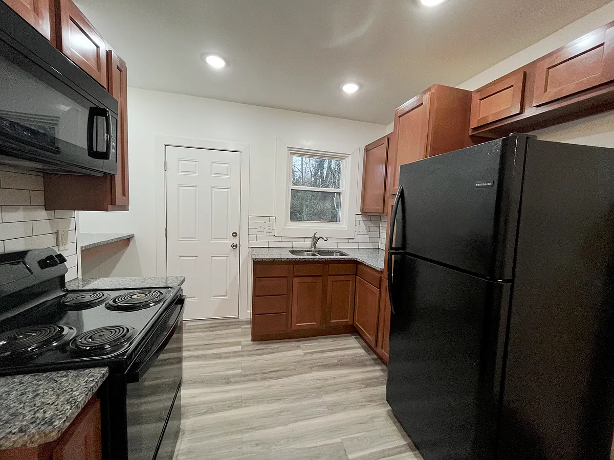 Fully stocked kitchen with custom cabinetry and appliances - 3329 Bevis Ave #1