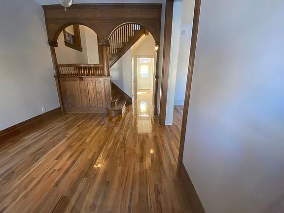 Custom rebuilt main staircase stuns when you enter from the front door! New handrail, columns, capitals, and archway all built by Mangrove.