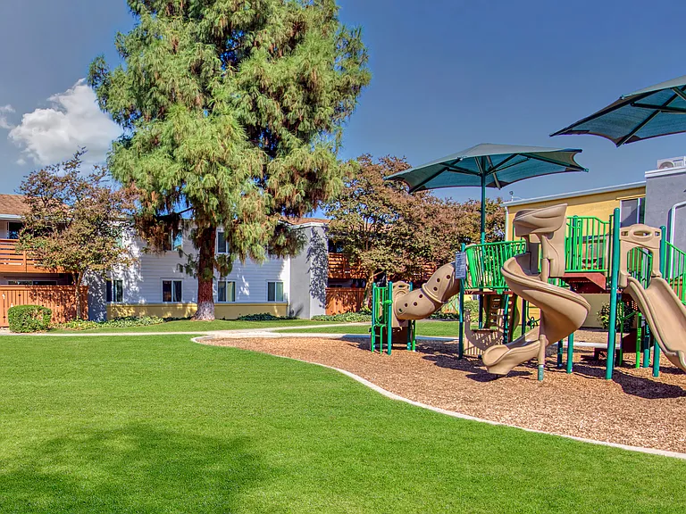 Vibrant playground and expansive green space for all ages.