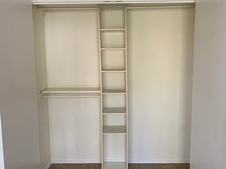 up back bedroom double closet in former Master BR