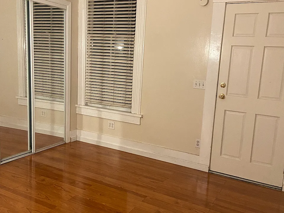 Bedroom with mirrored closet