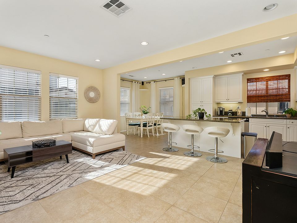 The Living Room, Kitchen and Dining open floor concept. The living room, kitchen, and dining area feature an open floor concept.