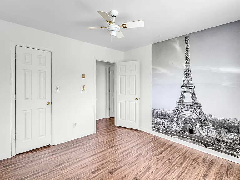 Paris themed bedroom with full bed