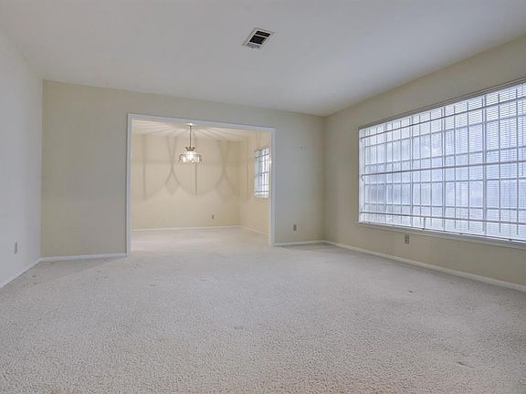 Formal living room is spacious and offers great space for casual gatherings or special occasions. Living room offers great sight lines to dining room. All carpet throughout home cleaned February 2022.