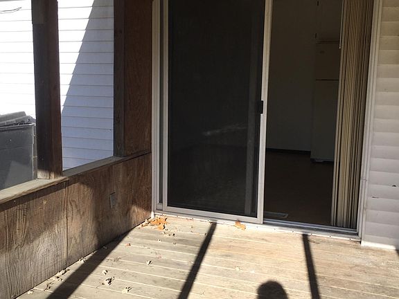 Back screened and covered porch off kitchen