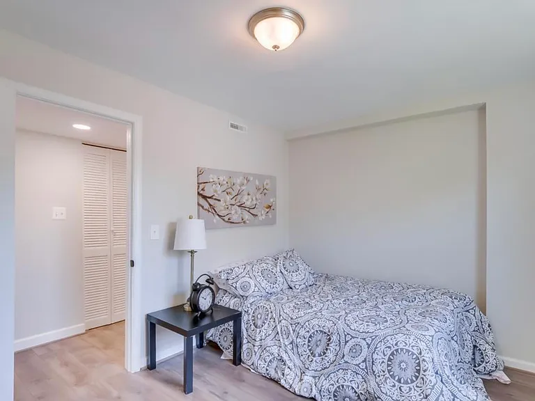 Downstairs bedroom across from washer/dryer and bathroom