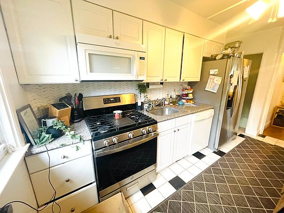 Kitchen with new stove and fridge