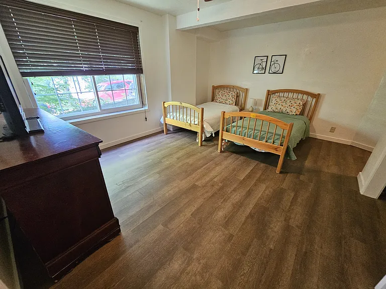 bedroom #3 (downstairs with its own door to yard). Has full attached bath