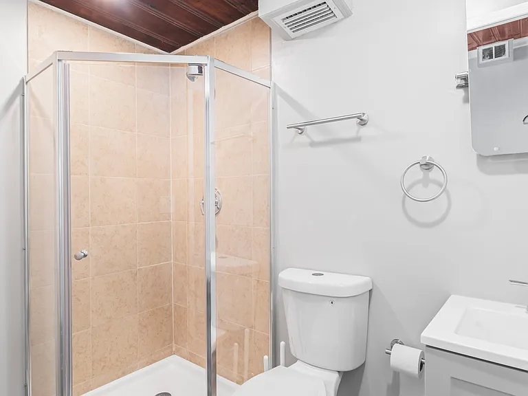 Sparkling tiled shower bath with plenty of space to refresh and unwind