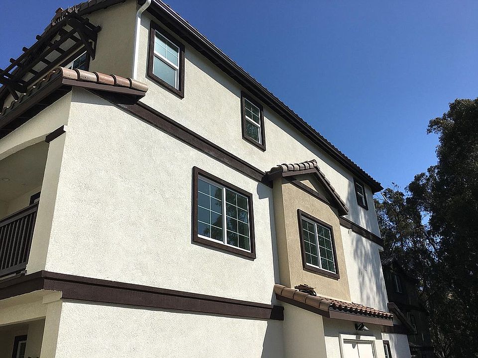 End unit with large side windows overlooking a tree-lined creek.