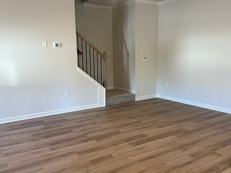 Family room with stairs to second floor.