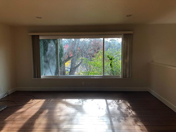 View from kitchen to living room. Hardwood floors recently refinished.