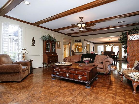 View of living area from the fireplace looking into the dining area and kitchen