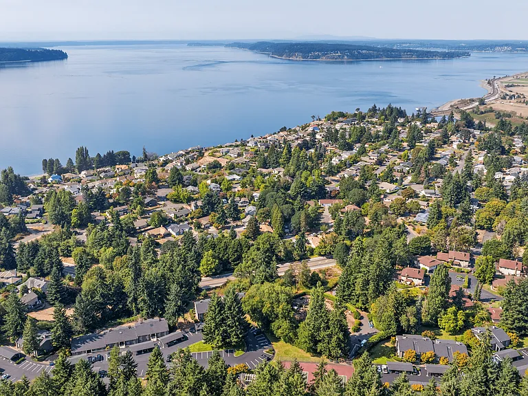 Scenic living surrounded by lush greenery and water views.