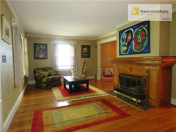 Original fireplace w/ beautiful hardwoods throughout.