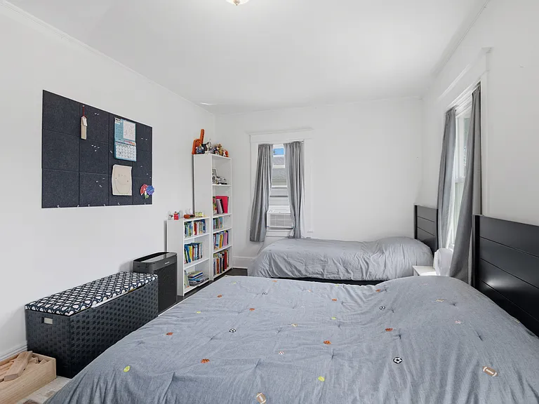 Spacious corner bedroom big enough for two beds