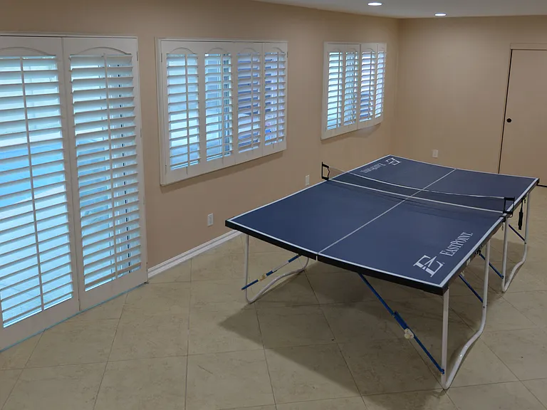 Room exits to pool and backyard area, from kitchen/dining area via sliding glass door.
