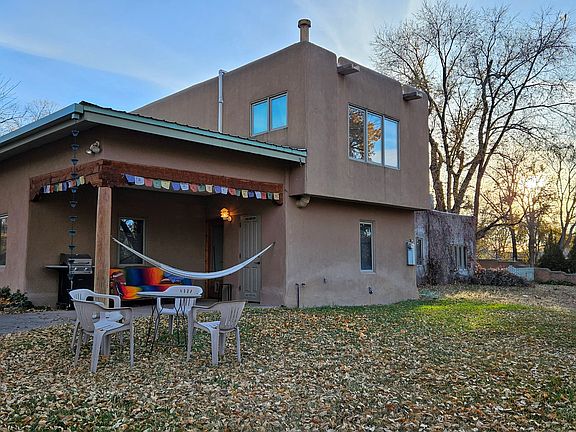 Entry portal with barbecue, couch and hammock