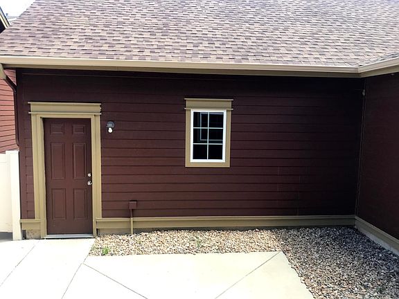 Private, fenced courtyard between town-home and garage.