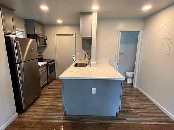 Kitchen with 3 sided "island" and ample cabinet space.