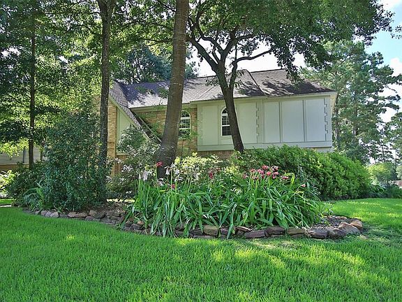 Sprinklers front, back and sides keep the landscaping and grass green and beautiful. Plenty of plants in place, with different flowers blooming year round.