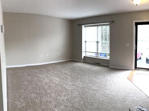 Updated family room with new paint and carpet!