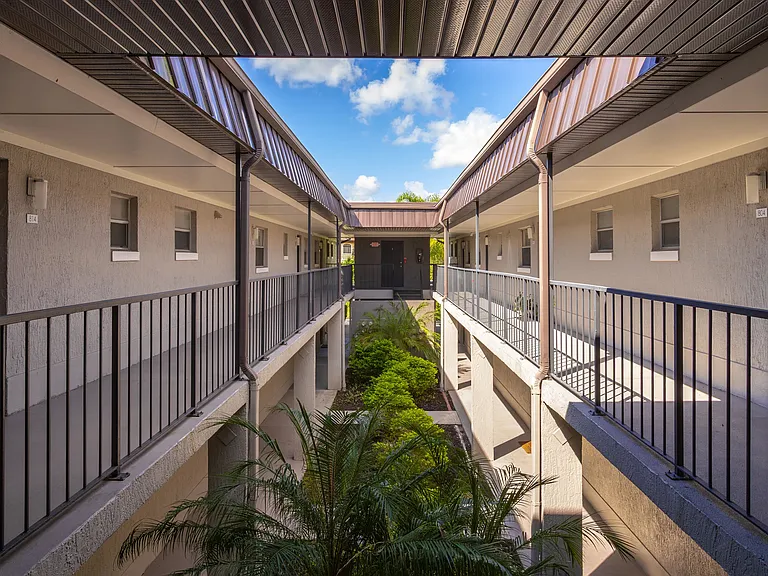 Enjoy the convenience of private entries at Poste. These modern walkways offer direct access to your apartment, providing enhanced privacy and a welcoming atmosphere in a well-maintained, lush courtyard setting.