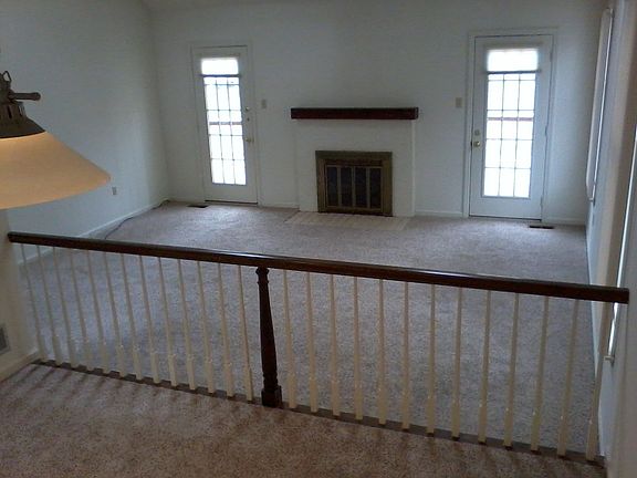 View of living room and doors to deck