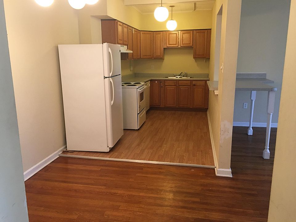 Kitchen with stove, fridge, and dishwasher.