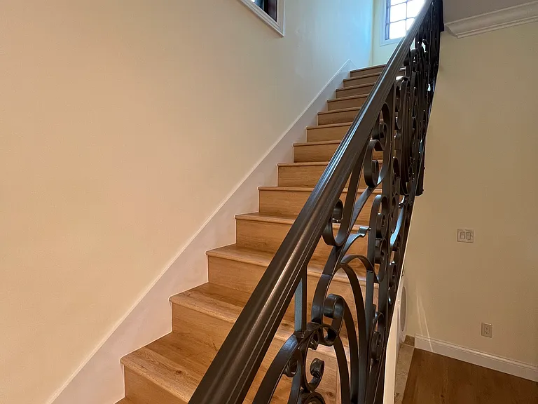 Staircase and View of First Floor Hallway