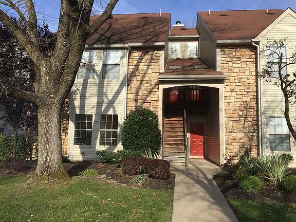 Condominium unit is lower two left windows.