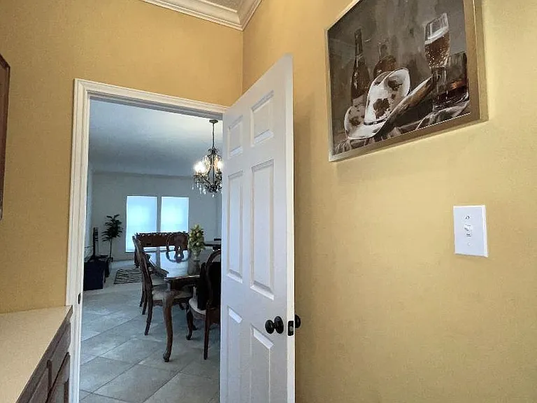 Butler's pantry leading from kitchen of formal dining room