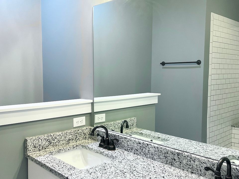 Master vanity, mirror, basins (not actual; photo of similar unit layout).