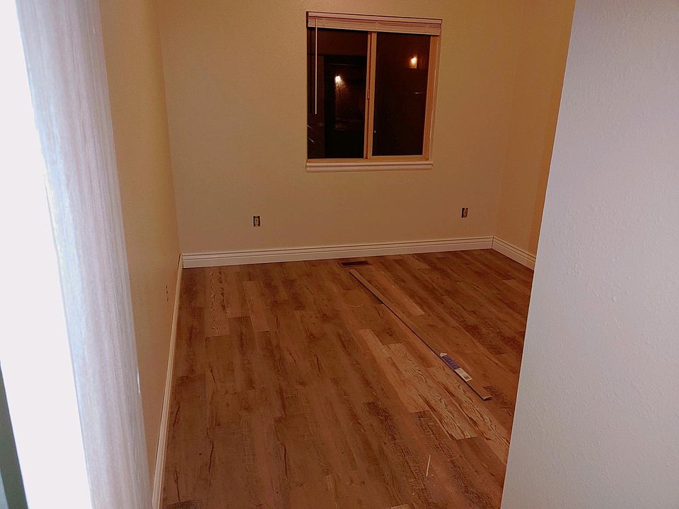 New flooring, baseboards, and freshly painted walls and ceilings in both spacious bedrooms.