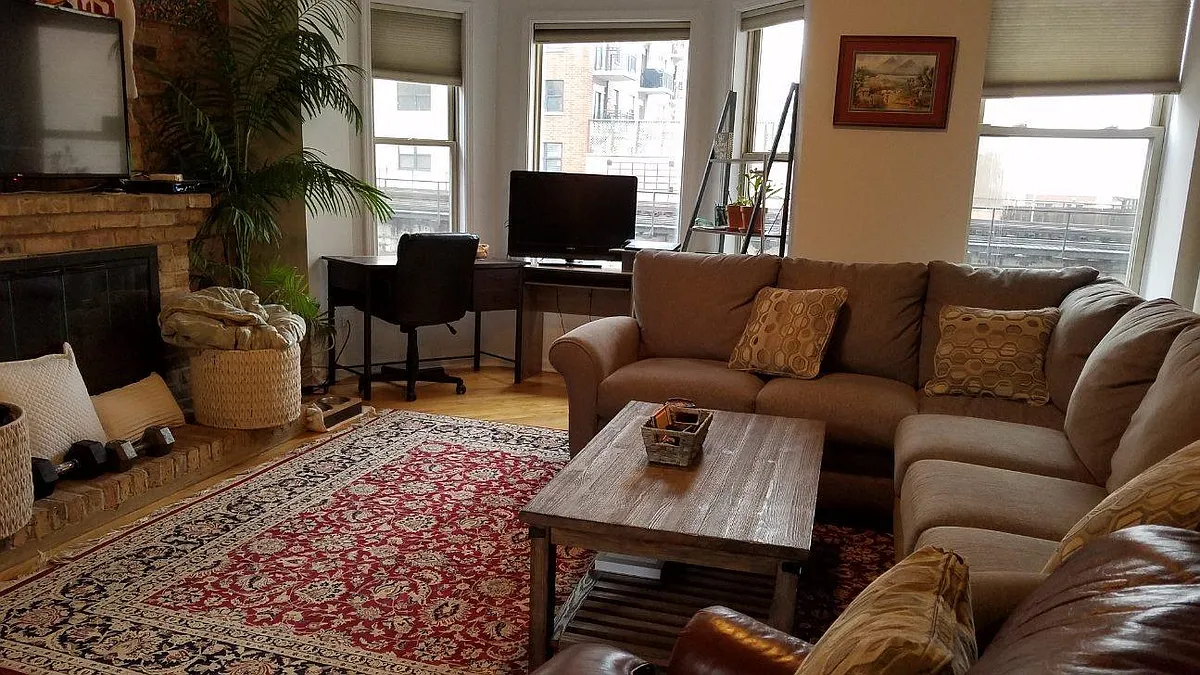 current furnishing...Exposed brick walls, wood floors, 13 foot loft ceiling, fireplace, double-paned windows and ceiling lights/fan - 1520 S Wabash Ave #4S