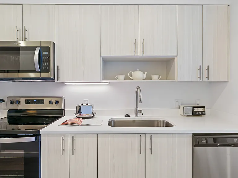 Fully Equipped Kitchens with Quartz Countertops and oversized sink
