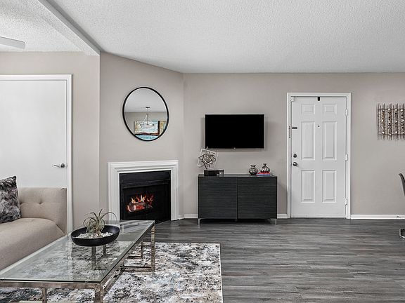 Living Room with Fireplace - Stonebridge Crossing Apartments