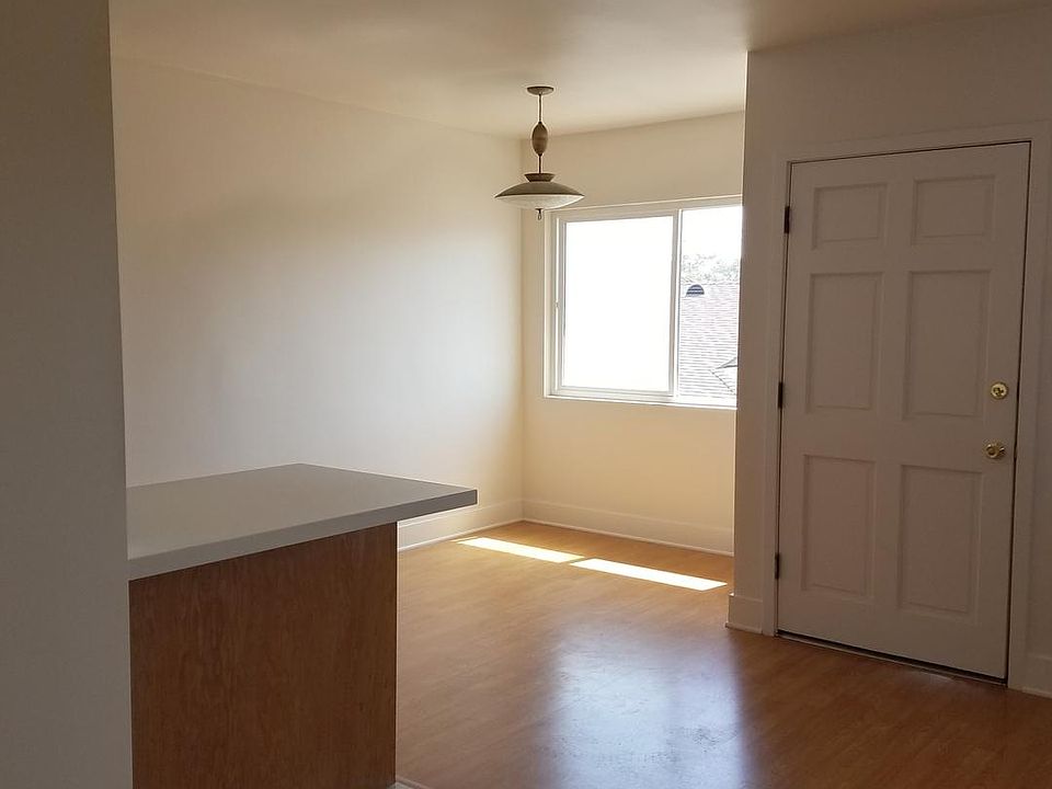 View of Front Door, Dining Room, Kitchen Island