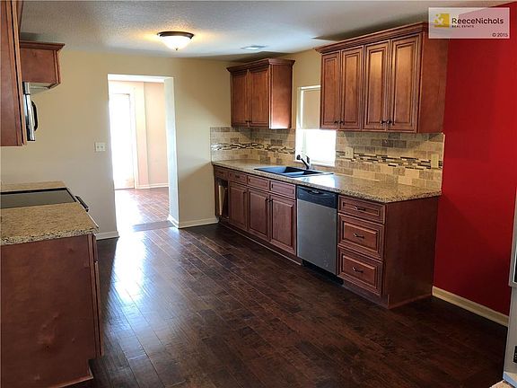 Kitchen with custom cabinets and granite counters.