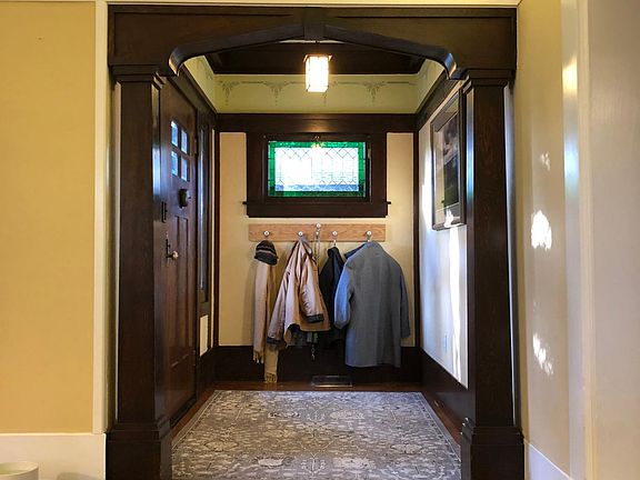 Original woodwork adorns the entryway